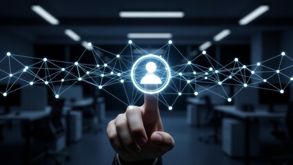 Hand pointing at glowing user icon in office network