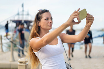 Woman taking a selfie in El Nido, Philippines, enjoying a tropical vacation