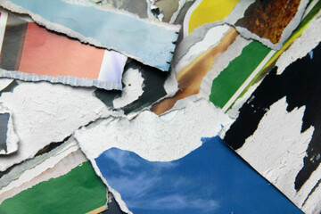 Fototapeta premium Multicolored poster paper, torn into numerous pieces.