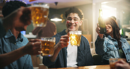 Event, friends and cheers with beer at pub for world cup win, football match celebration or bonding. Happy hour, group and people with alcohol toast in bar for sports game success, weekend and flare