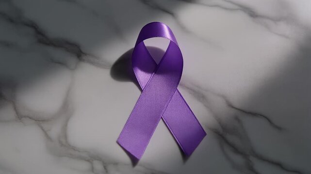 Purple Awareness Ribbon on Marble Surface for Cancer or Domestic Violence Support