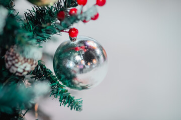Christmas tree decorated with twinkling lights and snowflakes. Holiday concept.
