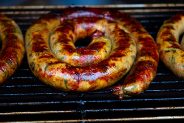 Northern Thai Sausage key aromatic ingredients typically infused into this delicacy include pungent lemongrass, fragrant kaffir lime zest and leaves, fiery red chilies, galangal root, and turmeric,spi