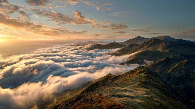 Stunning mountain range view with clouds rolling through valleys at sunrise, evoking a sense of peace and adventure for travel and nature enthusiasts