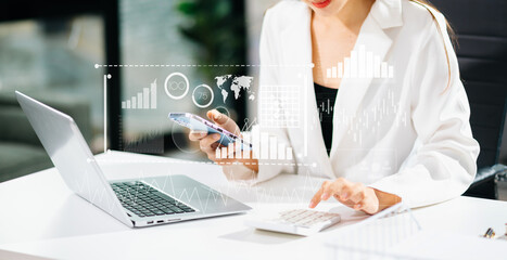 Financial report data of business operations balance sheet and income statement and diagram as Fintech concept.Business team meeting. digital tablet and computer laptop.