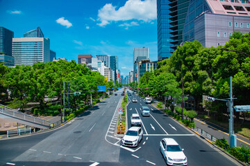 A cityscape of traffic jam at the city street in Tokyo in summer wide shot