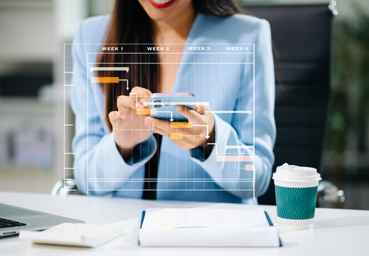 Project manager working and update tasks with milestones progress planning and Gantt chart scheduling diagram.business tram working at office