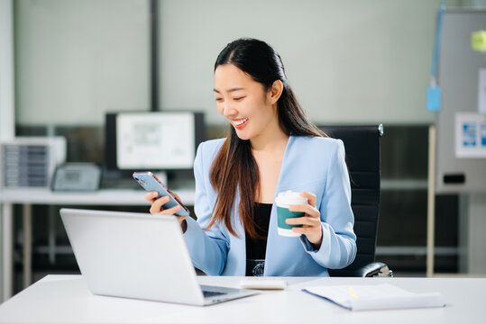Businesswoman Analyzing Finance on Tablet and Laptop at Office Desk tax, report, accounting, statistics, and analytical research concept