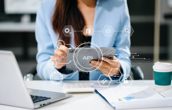 API Application Programming Interface, woman using laptop, tablet and smartphone with virtual screen API icon Software development tool, modern technology and networking concept.