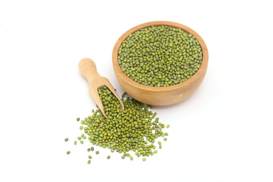 Whole green moong dal or mung beans or green gram (Vigna radiata) green legumes in wooden bowl