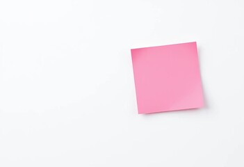 Close-up of a single pink sticky note on a white background, white background, adhesive note