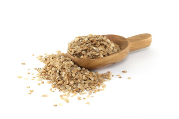 Pearl millet flakes spilled out of scoop on white background 