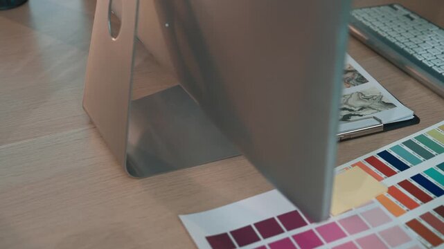 A modern workspace featuring colorful stationery and a sleek computer setup, designed to inspire creativity and organization in a professional environment. SACTR