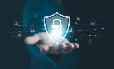 A glowing security shield with a digital padlock floating above a business hand, representing cybersecurity, data protection, privacy, encryption, safe access, and modern secure digital systems.