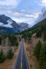 Long Winding Mountain Road Through Dense Forests and Misty Valleys in British Columbia, Canada