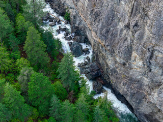 Rugged Canyon and River Gorge Surrounded by Evergreen Forests and Towering Cliffs in BC, Canada