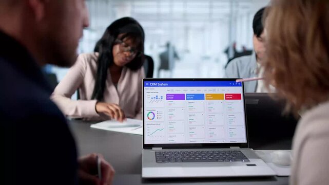 Dedicated Team Of Employees Working - Powered by Adobe
