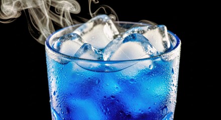 Mysterious Blue Cocktail With Ice and Smoke on a Dark Background