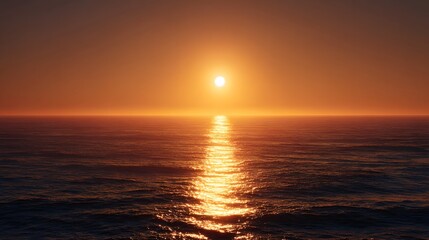 Fototapeta premium Golden Sunset Over Calm Ocean Waters with Reflective Path.