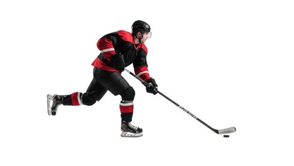 Obraz premium Determined ice hockey player in black and red uniform skating aggressively with stick controlling puck on white background, showcasing speed, balance, power and high‑intensity rink competition