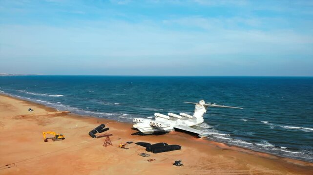 Aerial view of a lun class ekranoplan on a sandy beach. Media