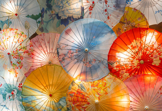 colorful traditional Chinese paper umbrellas as decoration - Powered by Adobe