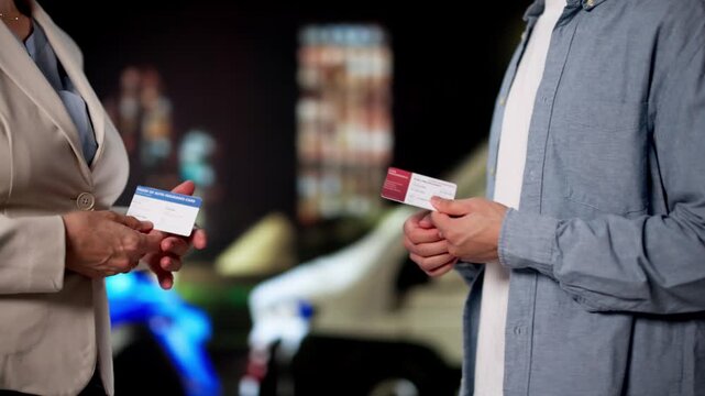 Drivers Calmly Exchanging Insurance Information After Car Accident