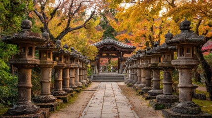 Obraz premium A tranquil pathway appears in a Japanese garden filled with vibrant autumn foliage. Stone lanterns line the path guiding visitors towards a wooden gate in the distance.