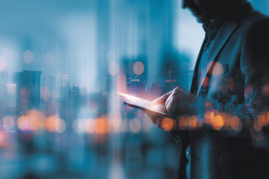 Digital technology, Business network connection, Teamwork, Deal, Partnership and data exchange, Investment analysis, planning and strategy. Businessman working with digital device on smart city