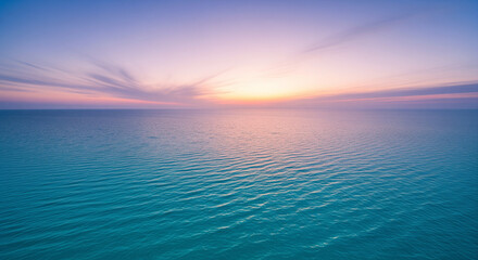 Calm ocean at sunset tranquil seascape with pastel colours perfect for travel and relaxation themes