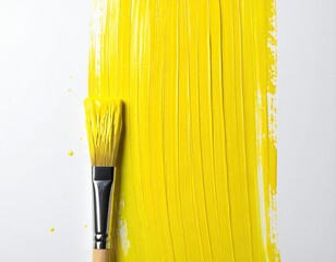 Bright yellow paint stroke on white paper, artist's brush