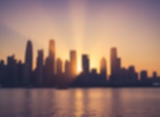 Obraz premium Golden Hour Glow: A Blurred Cityscape Bathed in Warm Sunset Light over Calm Waters