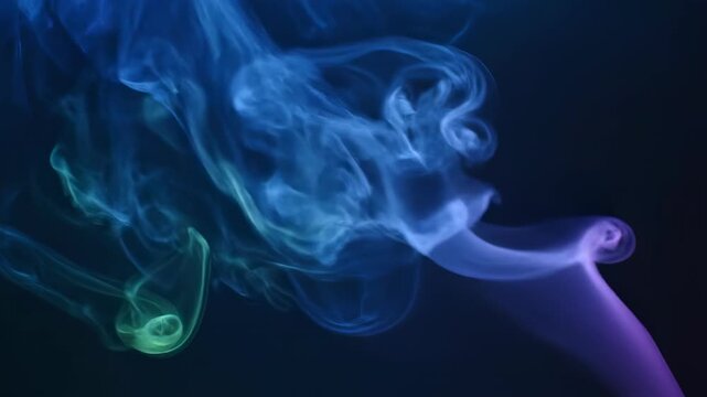 Abstract blue smoke waves flow in smooth motion patterns over a dark black background creating an artistic swirl of light and soft energy design