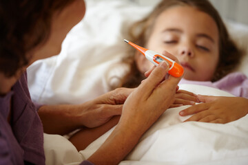 Sick, mother and child with thermometer by bed, monitor fever and temperature for wellness check. Flu, illness and woman with sleeping daughter for health evaluation, support and comfort for care