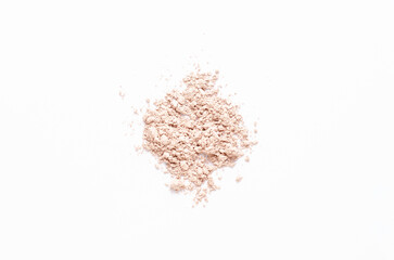 A sample of dry cosmetic clay for a mask or cosmetic powder. White background