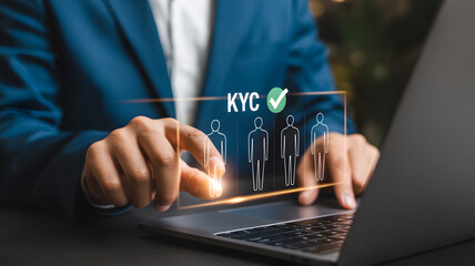 Professional business photo showing hands using laptop with holographic KYC interface digital identity verification and cybersecurity concept