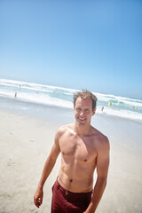 Portrait, man and happy at beach for travel, getaway adventure and summer holiday. Above, male person and shirtless on trip with space of tourism fun, explore nature and tropical vacation on seashore
