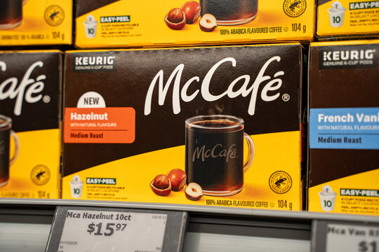Close up of McCafe hazelnut coffee pod box on supermarket shelf. Toronto, Canada - November 26, 2025.