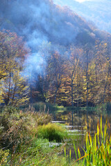 Smoke on Gosh lake in Autumn. Tavush, Armenia