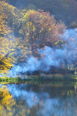 Smoke on Gosh lake in Autumn. Tavush, Armenia