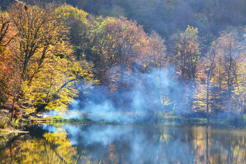Smoke on Gosh lake in Autumn. Tavush, Armenia