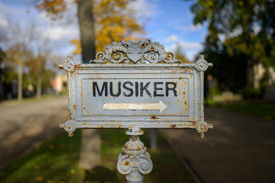 Old iron sign musicians honorary graves Zentralfriedhof Vienna Austria autumn sunny day