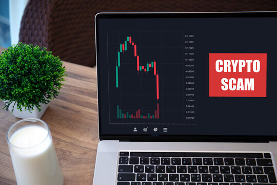 computer laptop with chart scam crypto coins on screen cafe