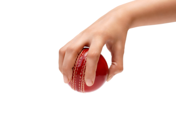 Hand gripping a red cricket ball, ready for action a