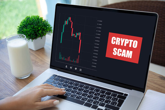 female hand keyboard laptop with chart scam crypto coins screen
