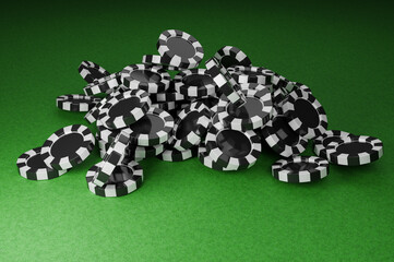 The black and white poker chips are piled high on the green felt table