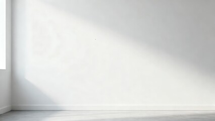 Empty room with white walls and natural light streaming in.