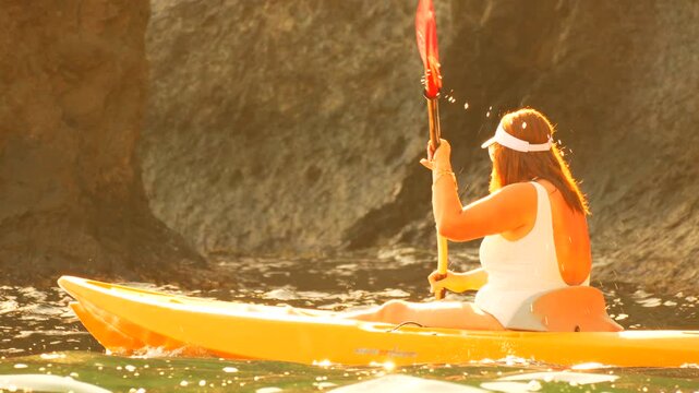 Kayaking adventure woman paddling sunny cove summer vacation active lifestyle - Powered by Adobe