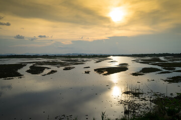 Lake or lagoon on the evening with sunset and reflection on the water.