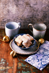 Traditional christmas cookies in a bowl on a rustic wooden background. Soft focus.	